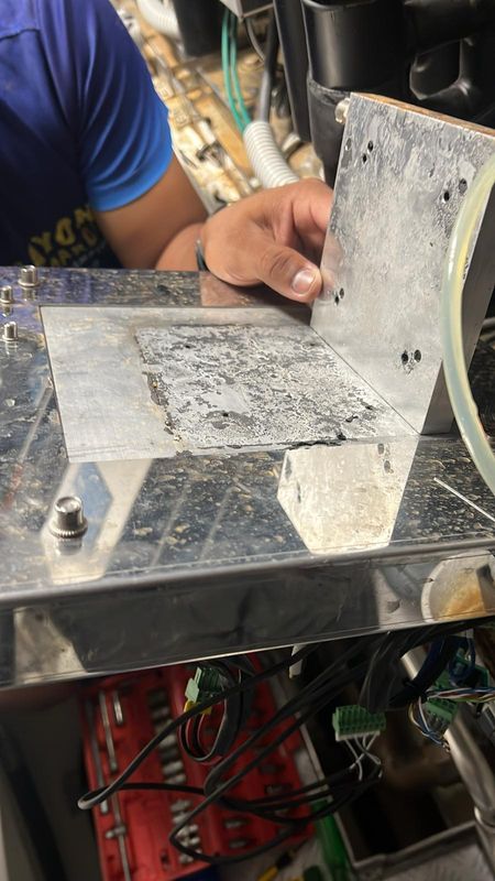 Metal plate removed near a bonding point in the machinery space.