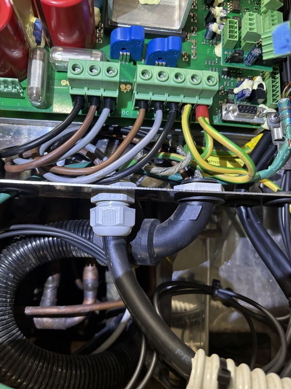 Unit 3 inverter cabinet: DC terminals and wiring below the board.