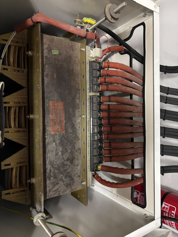 Isolation transformer with cover off: windings and terminal board.