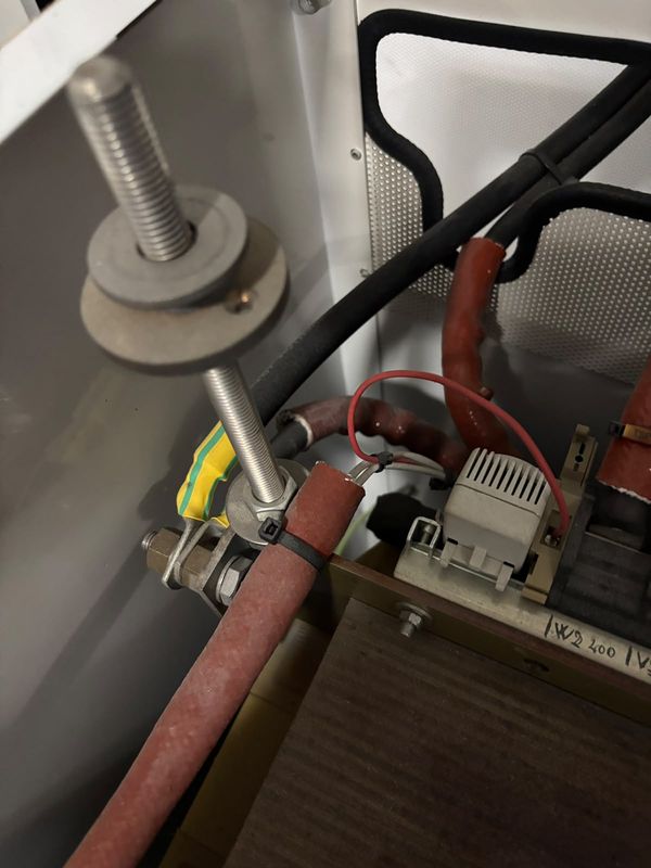 Isolation transformer frame earth bond: lug clamped to a stainless threaded rod.