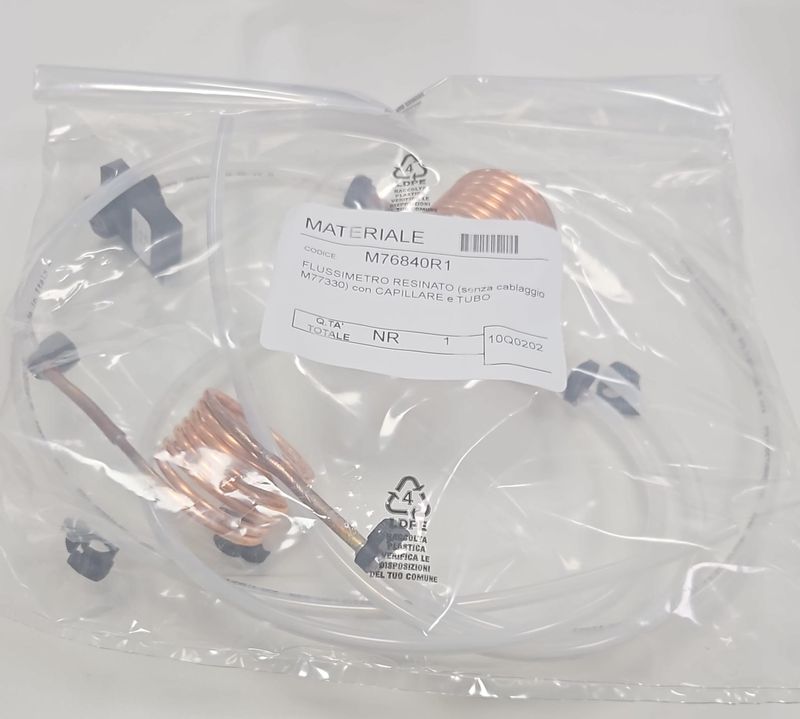 Replacement flowmeter (part M76840R1) as delivered, in its bag.