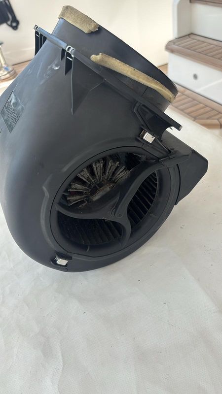 Cabin fan-coil blower unit removed, showing the condition of the impeller housing.