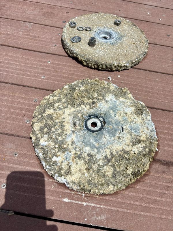 Pair of transom anodes removed, with their mounting hardware.