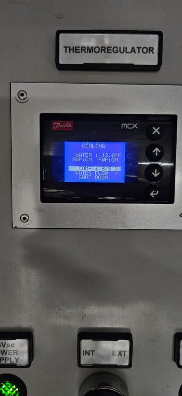 Controller main screen: cooling water 13 °C, COMP 3 of 3, both pumps ON, as displayed. Reading only, no cause implied.